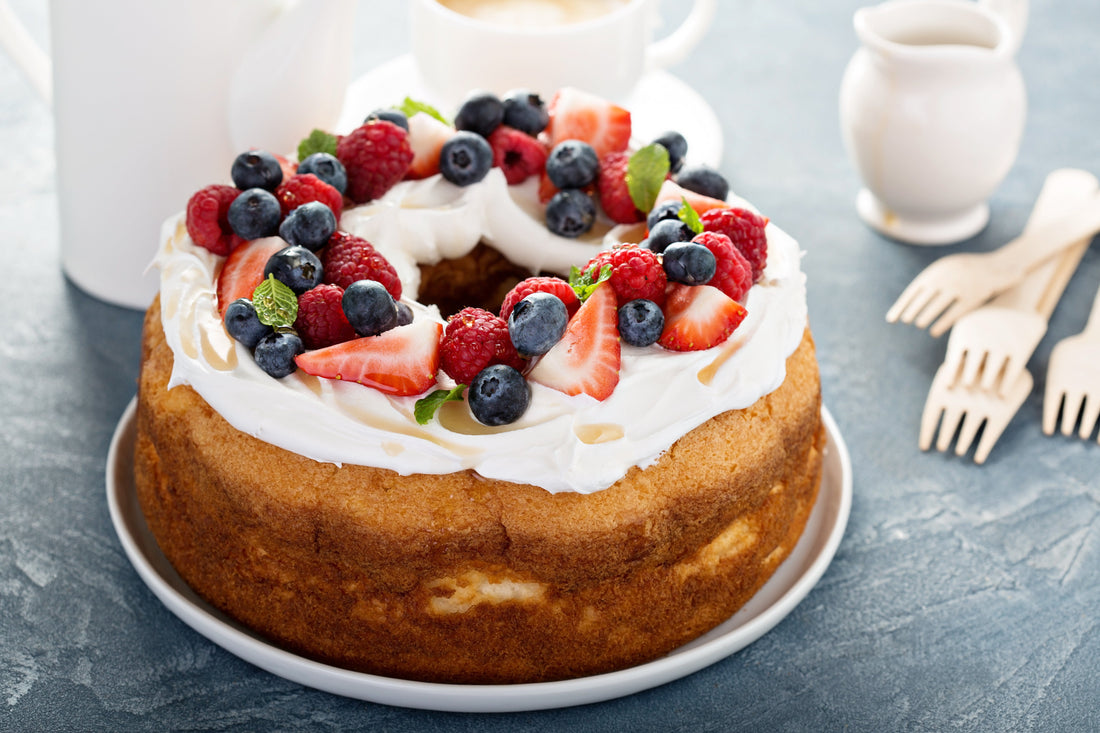 Angel food cake with fresh fruit and whipped cream