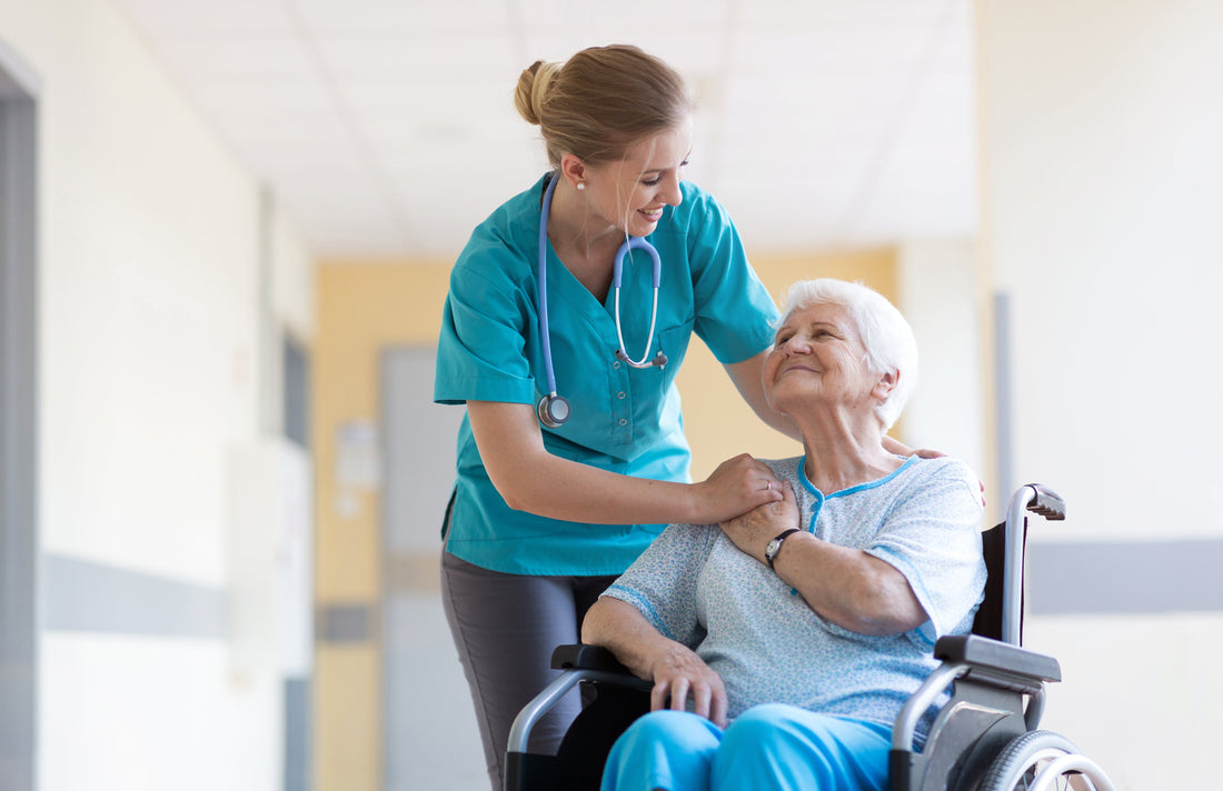 Nurse helping an older patient in a wheelchair