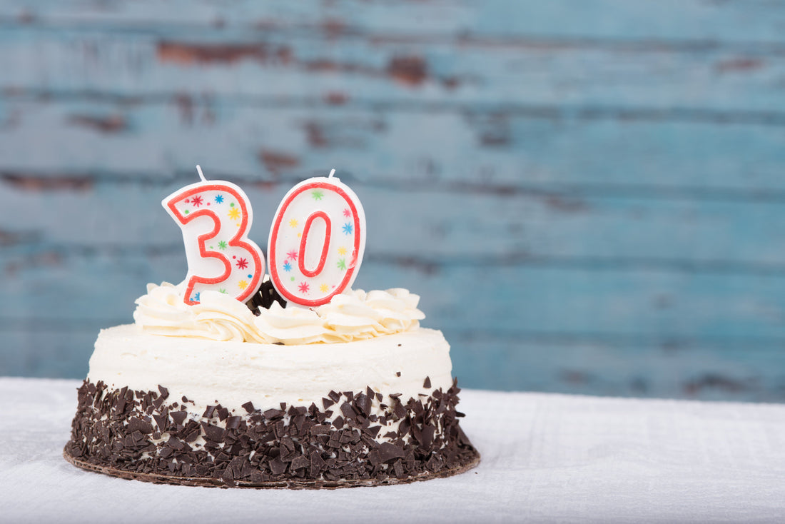 chocolate cake with number 3 and 0 candles for 30th birthday