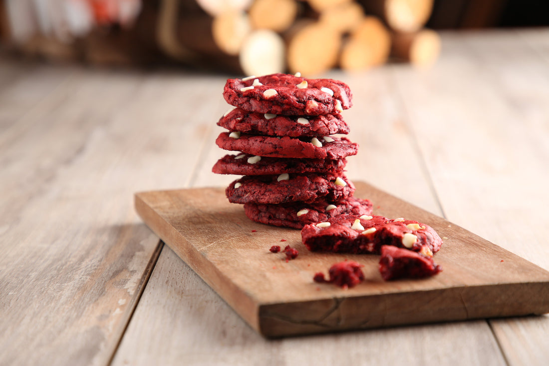 red velvet cookies on a wood serving board