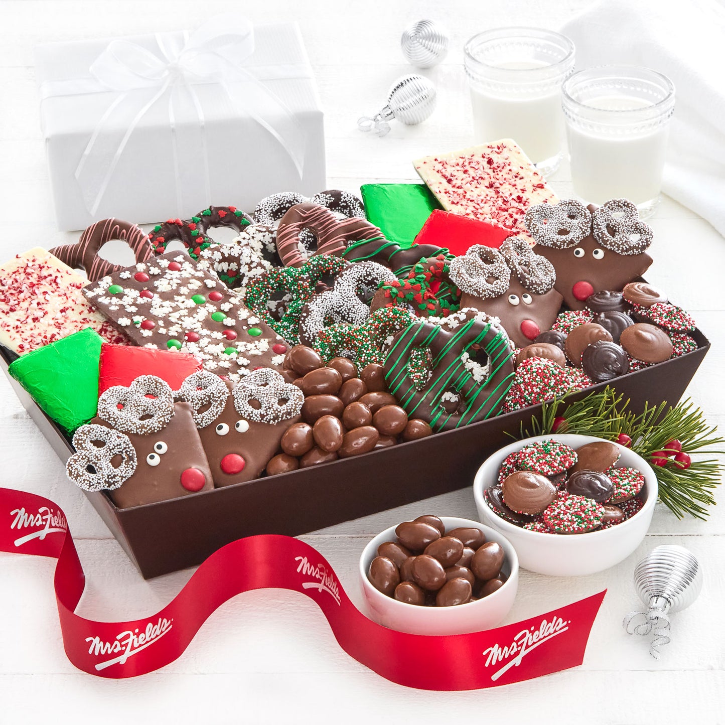 A tray filled with an assortment of holiday-themed chocolate-covered treats