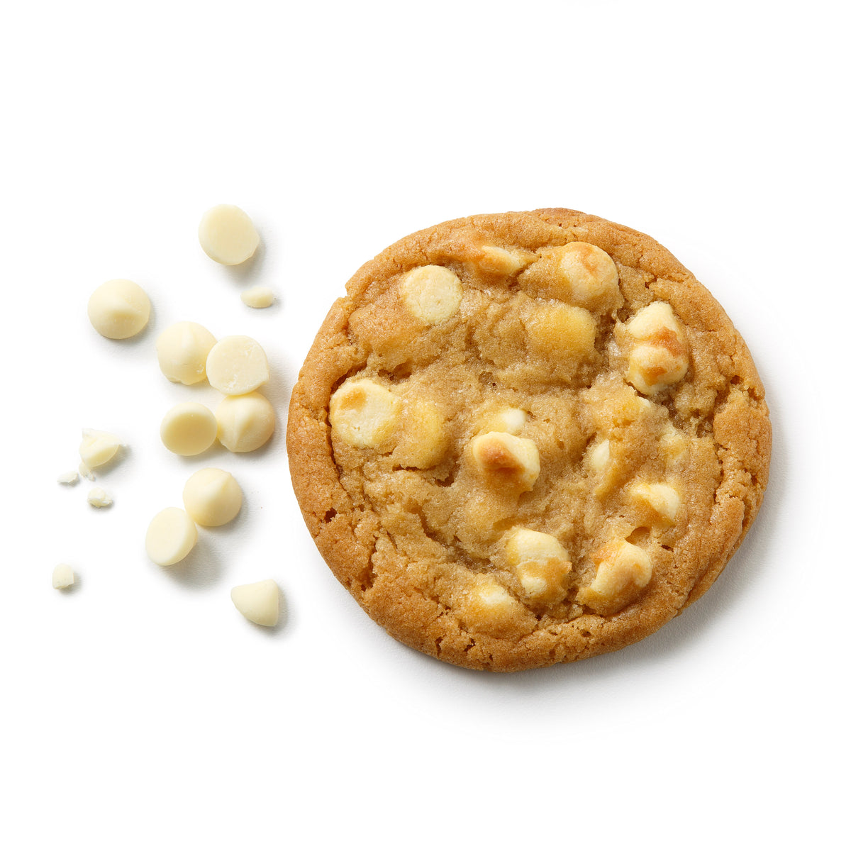A round white chocolate chip cookie with golden-brown edges and pale white chocolate chunks, photographed on a clean white background with a few scattered white chocolate chips beside it.