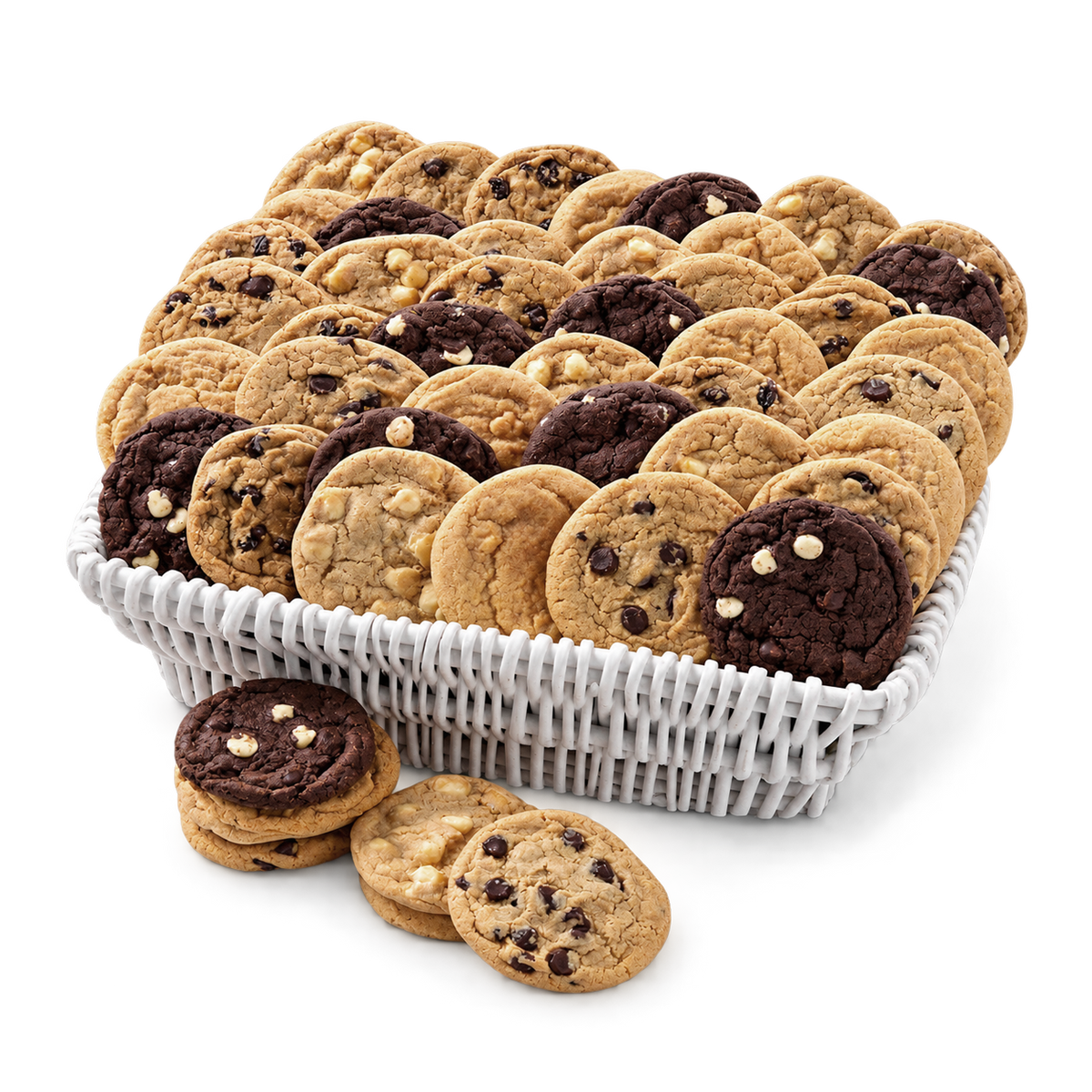 A white woven basket filled with assorted cookies, including chocolate chip cookies and sugar cookie dough pieces, with several cookies placed in front on a clean white background.