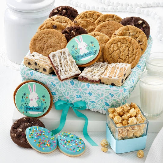 A floral decorated gift basket filled with an assortment of original cookies, frosted cookies, logo cookies, and popcorn