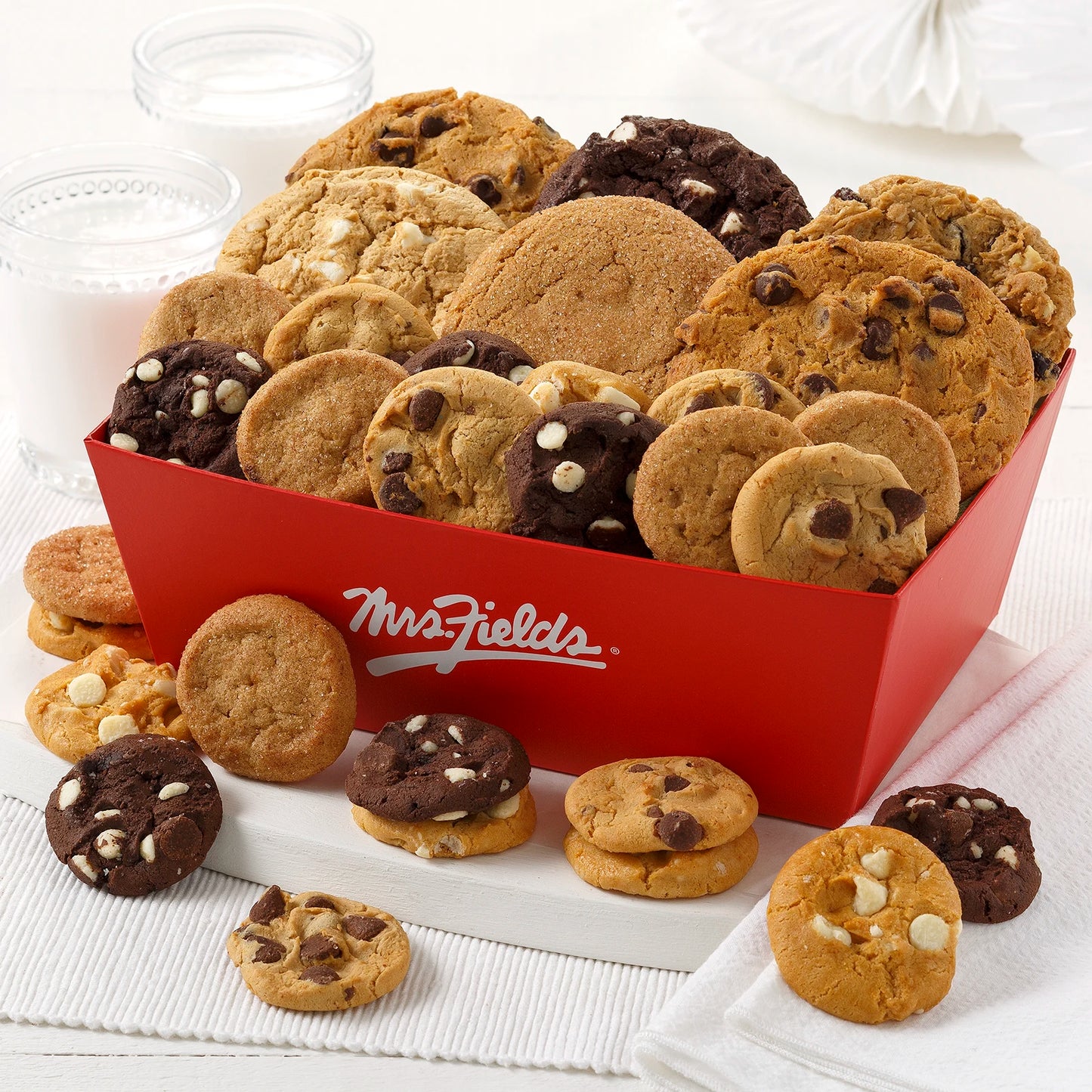Signature red Mrs. Fields Crate filled with cookies and Nibblers® Bite-Sized Cookies