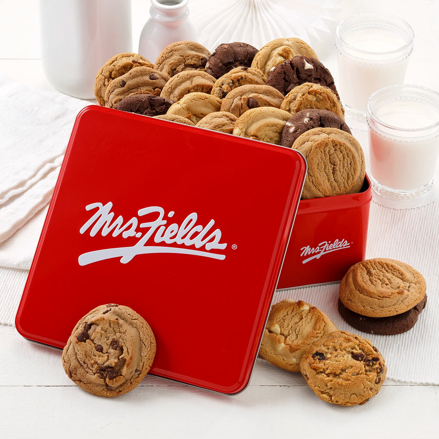 Mrs. Fields red signature tin filled with a variety of original cookies