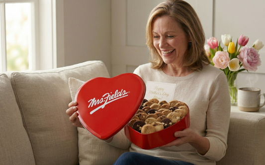 Mrs. Fields ['gift baskets for mom', '8,000–14,000 / mo', 'Medium (40–50)', '$1.50–$2.40', 'Shopping Ads, PAA, Image Pack', 'Top 5 within 6 months'] cookie gift box with ribbon