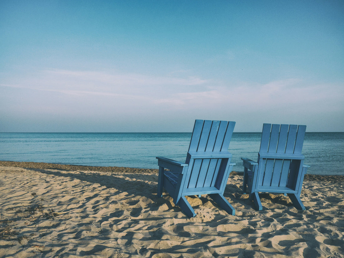  Two chairs on beach facing ocean