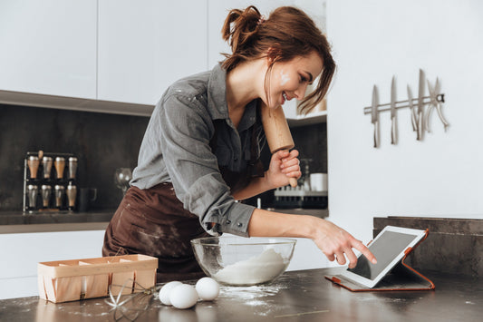 Woman baking unique cookie recipes at home 