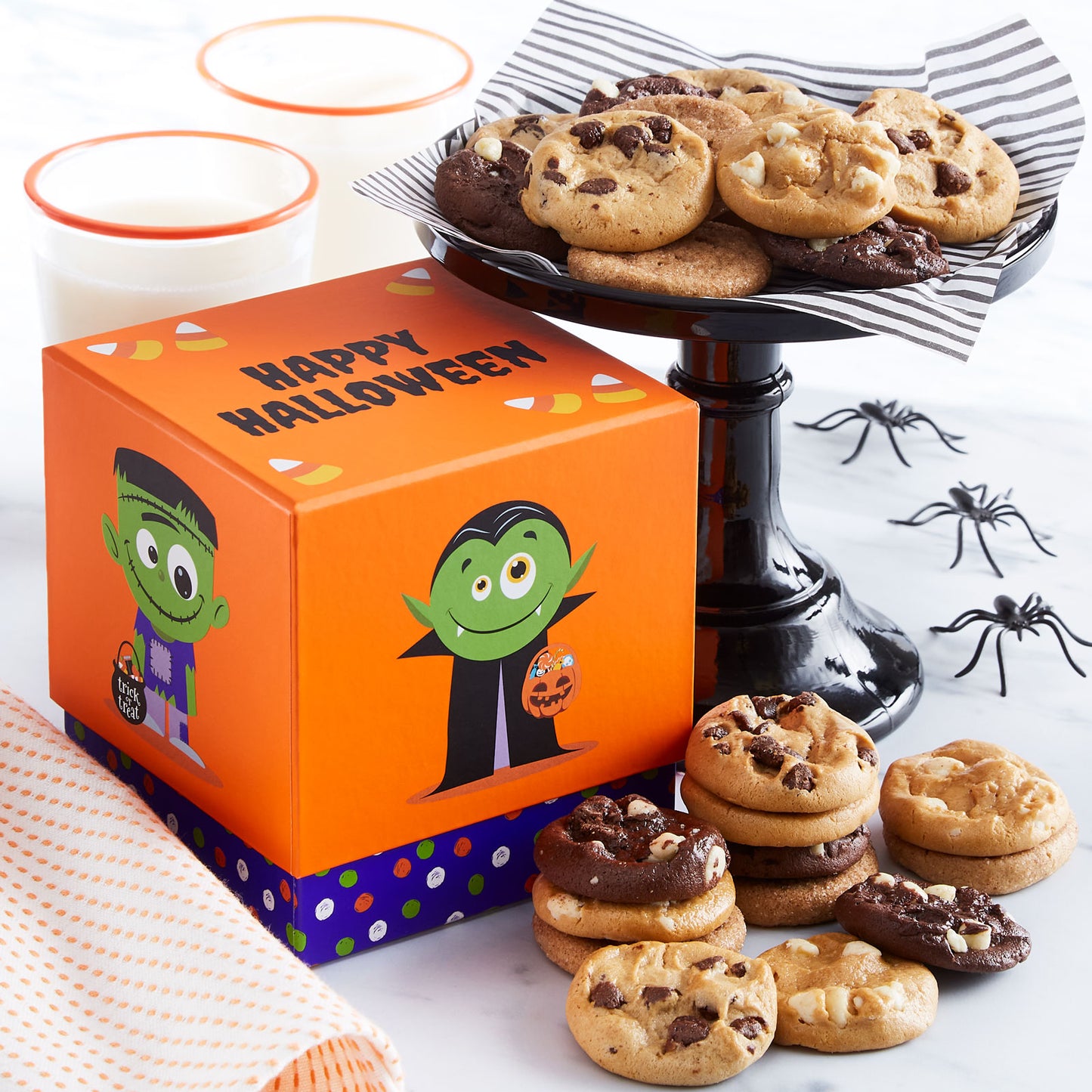 Halloween orange themed mini gift box with an assortment or Nibbers® on the side
