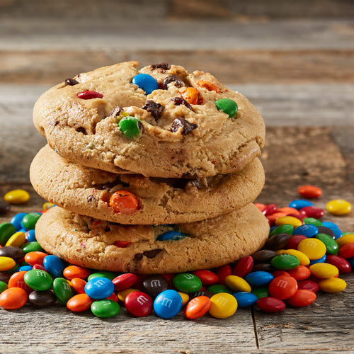 Lifestyle image of three M&M cookies stacked