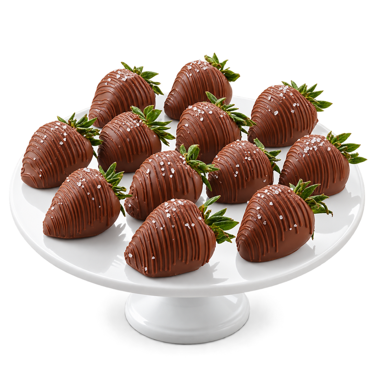 A plate of chocolate-covered strawberries with sea salt on top, presented on a white plate with a white background.