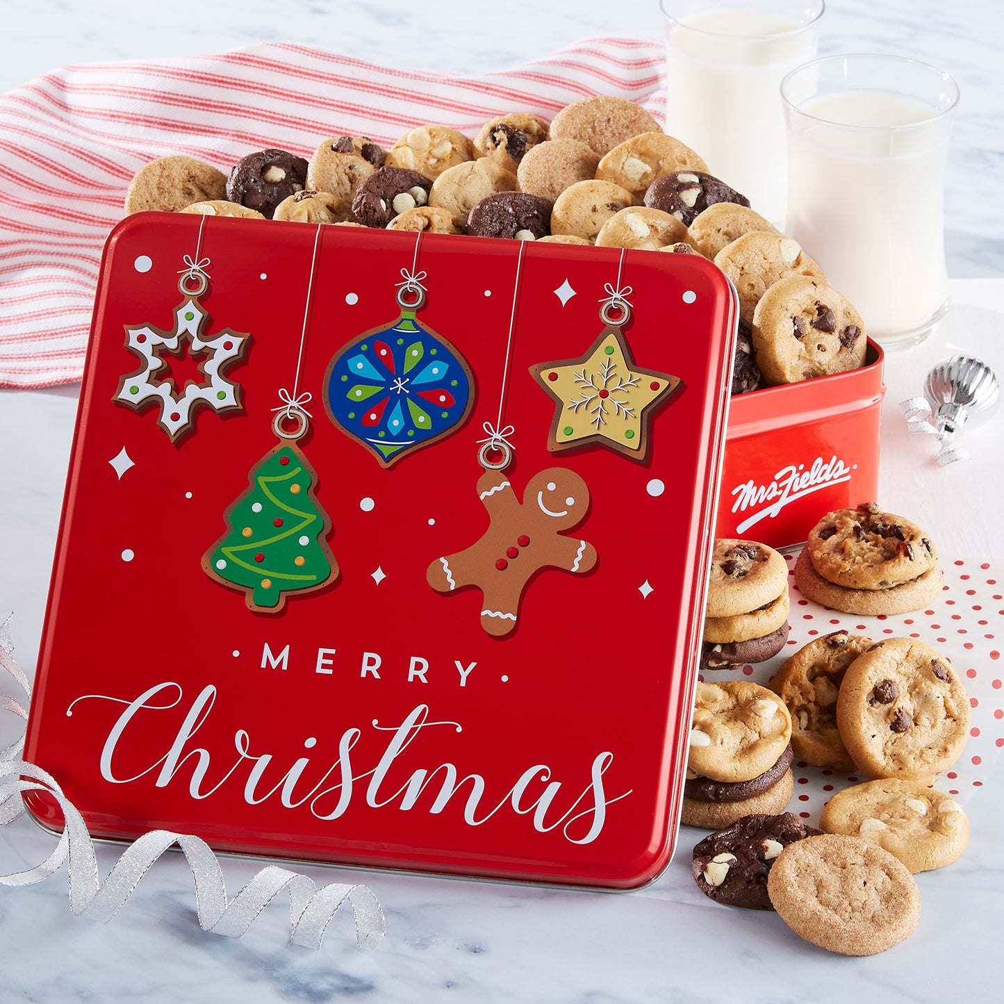 Red Merry Christmas gift tin with ornaments as decorations. This tin is filled with an assortment of Nibblers®