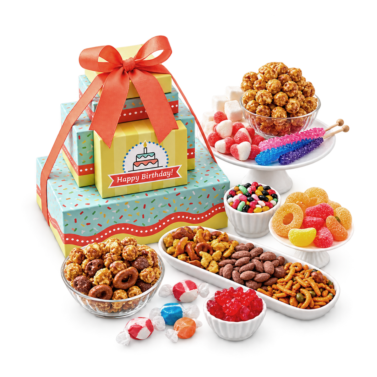 A colorful birthday gift set featuring stacked gift boxes with a red ribbon and a 'Happy Birthday!' card, surrounded by assorted treats including popcorn, candy, pretzels, and gummy candies on a transparent background.