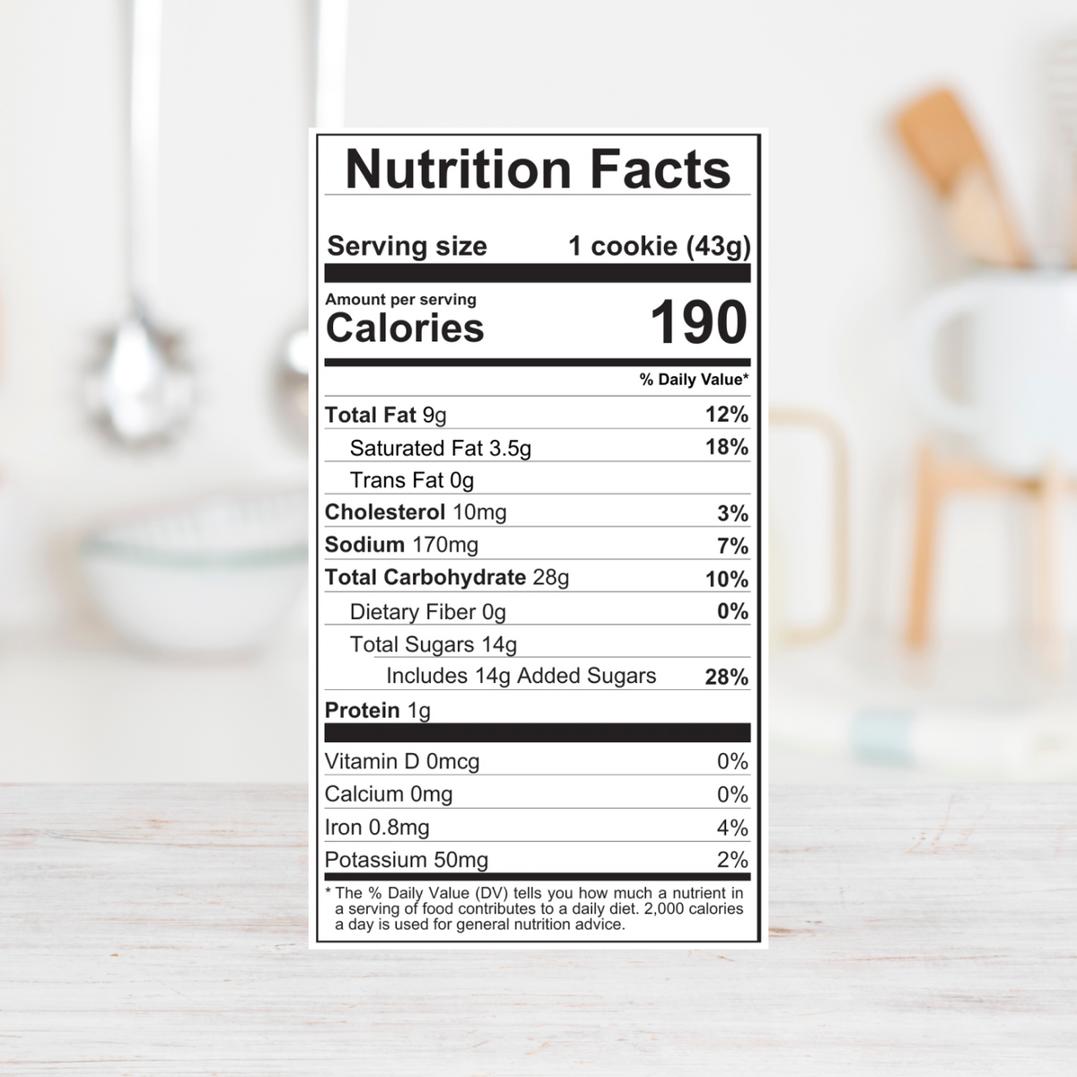 A Nutrition Facts label for a cookie, showing serving size 1 cookie (43g) and calories 190 per serving, with a black-and-white table listing nutrients like total fat, saturated fat, cholesterol, sodium, total carbohydrate, dietary fiber, sugars, and protein.