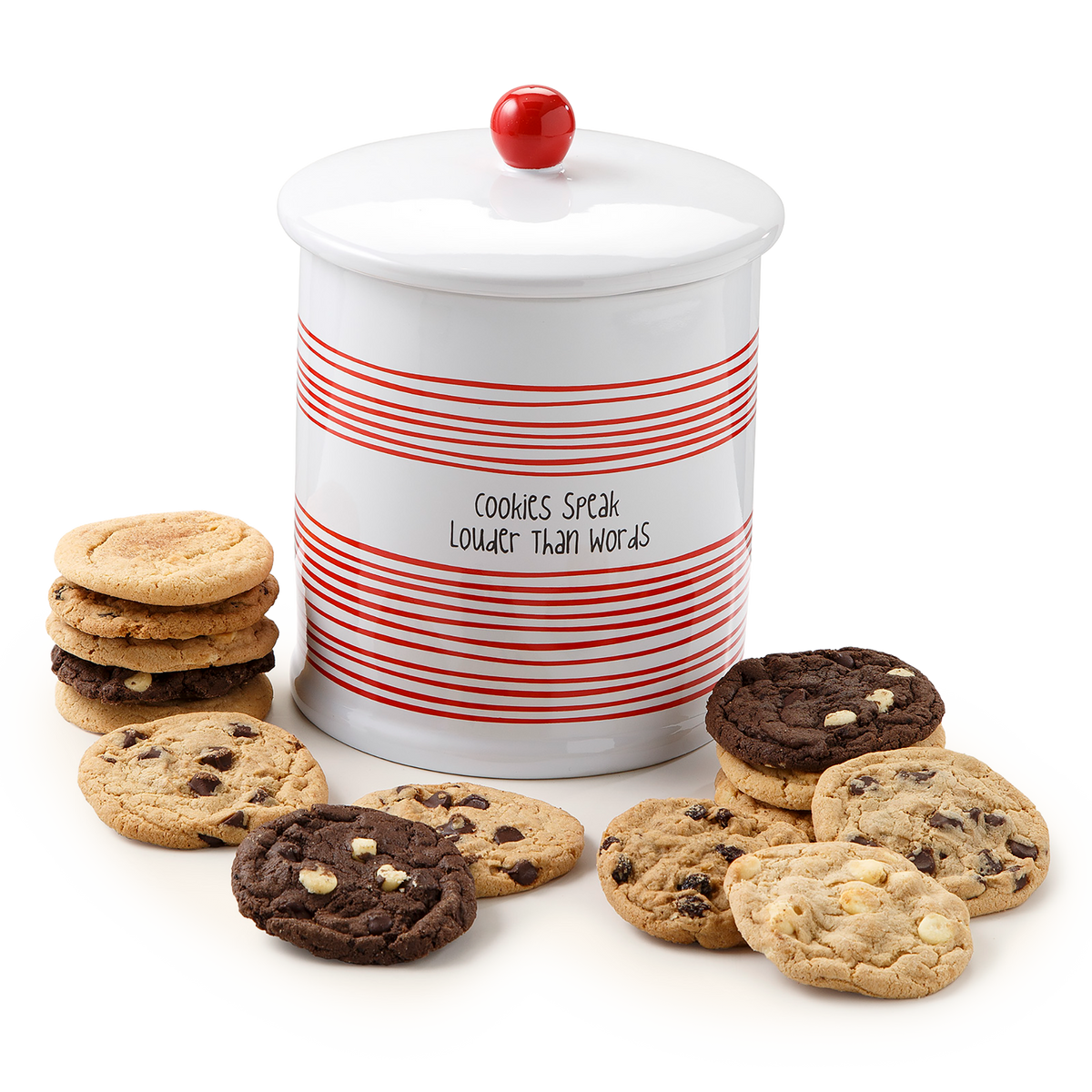 A white ceramic cookie jar with red horizontal stripes and a red ball topper, labeled 'COOKIES SPEAK LOUDER THAN WORDS,' surrounded by assorted chocolate chip cookies on a white background.