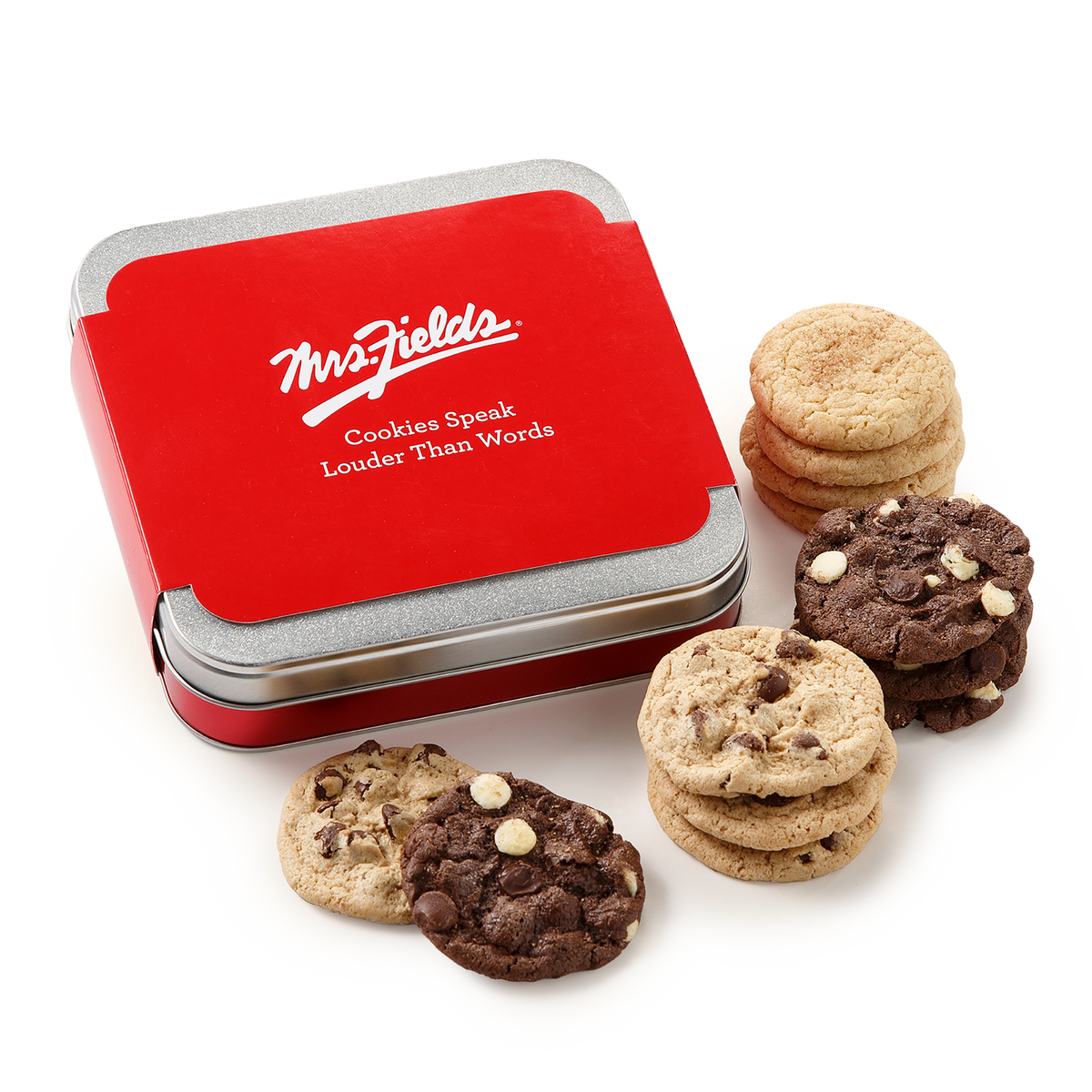 A red and silver Mrs. Fields cookie tin with several assorted chocolate chip cookies arranged around it on a clean white background.