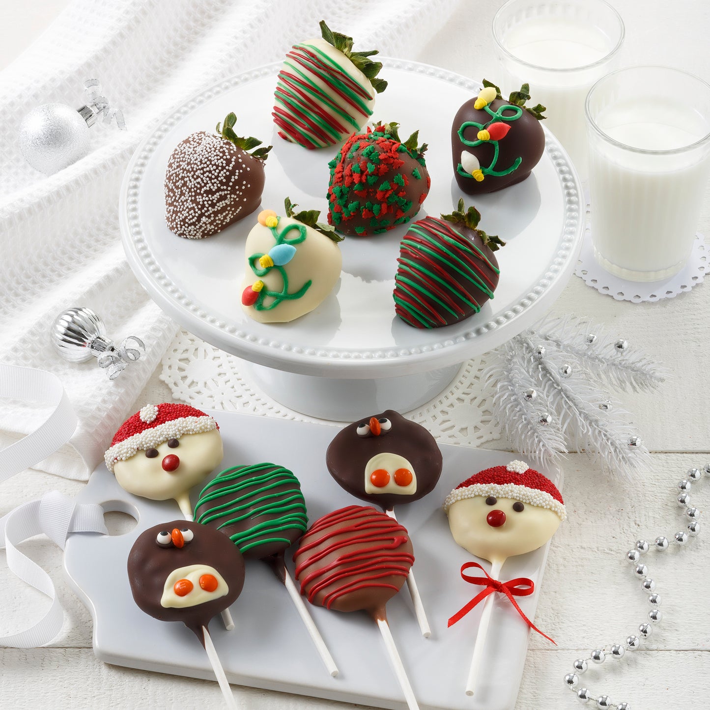 Six chocolate-covered strawberries and six chocolate-covered Nibbler® pop that are all decorated in a holiday theme