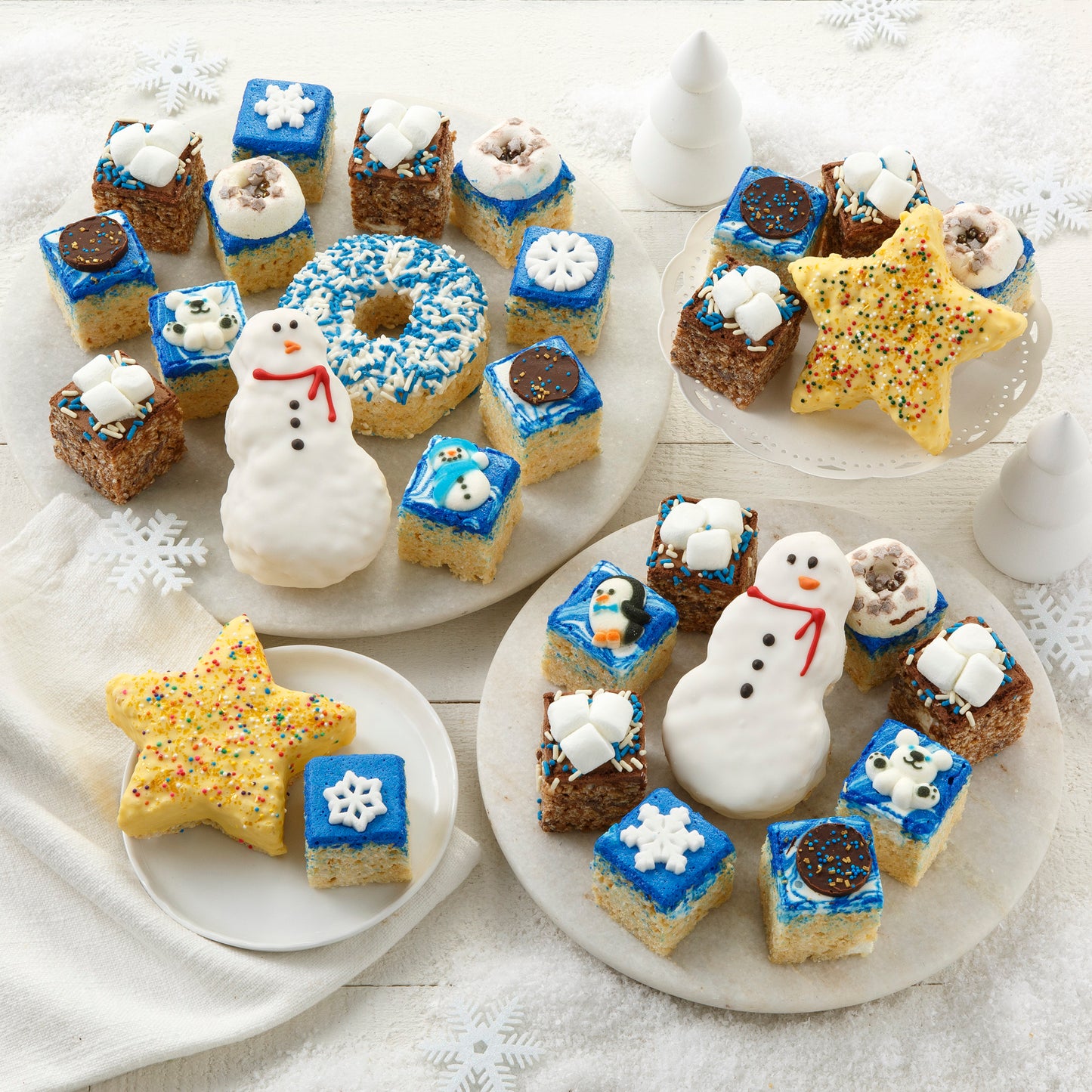 An assortment of different-shaped winter-decorated rice krispie treats