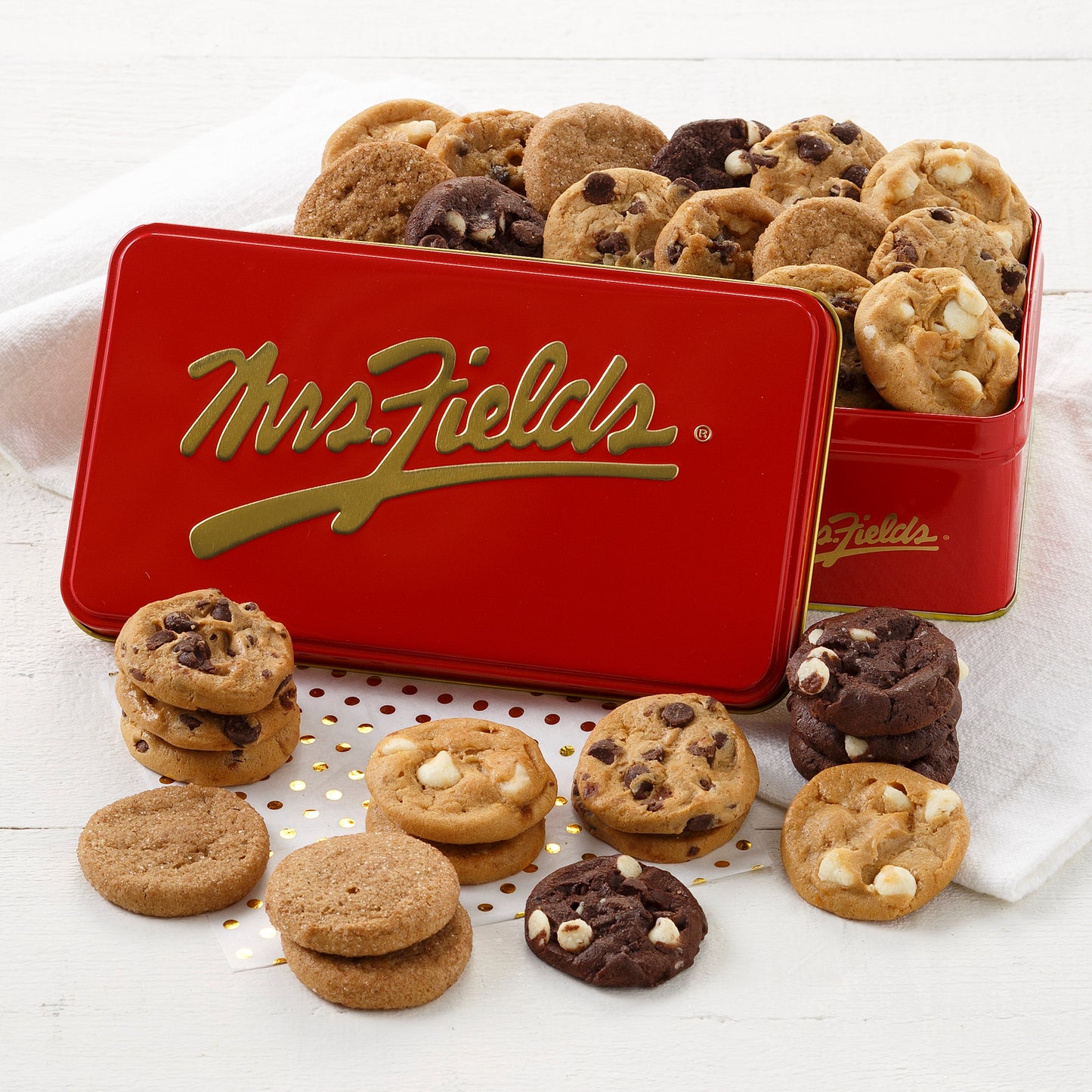 A red and gold signature 30 Nibbler tin filled with an assortment of Nibblers®