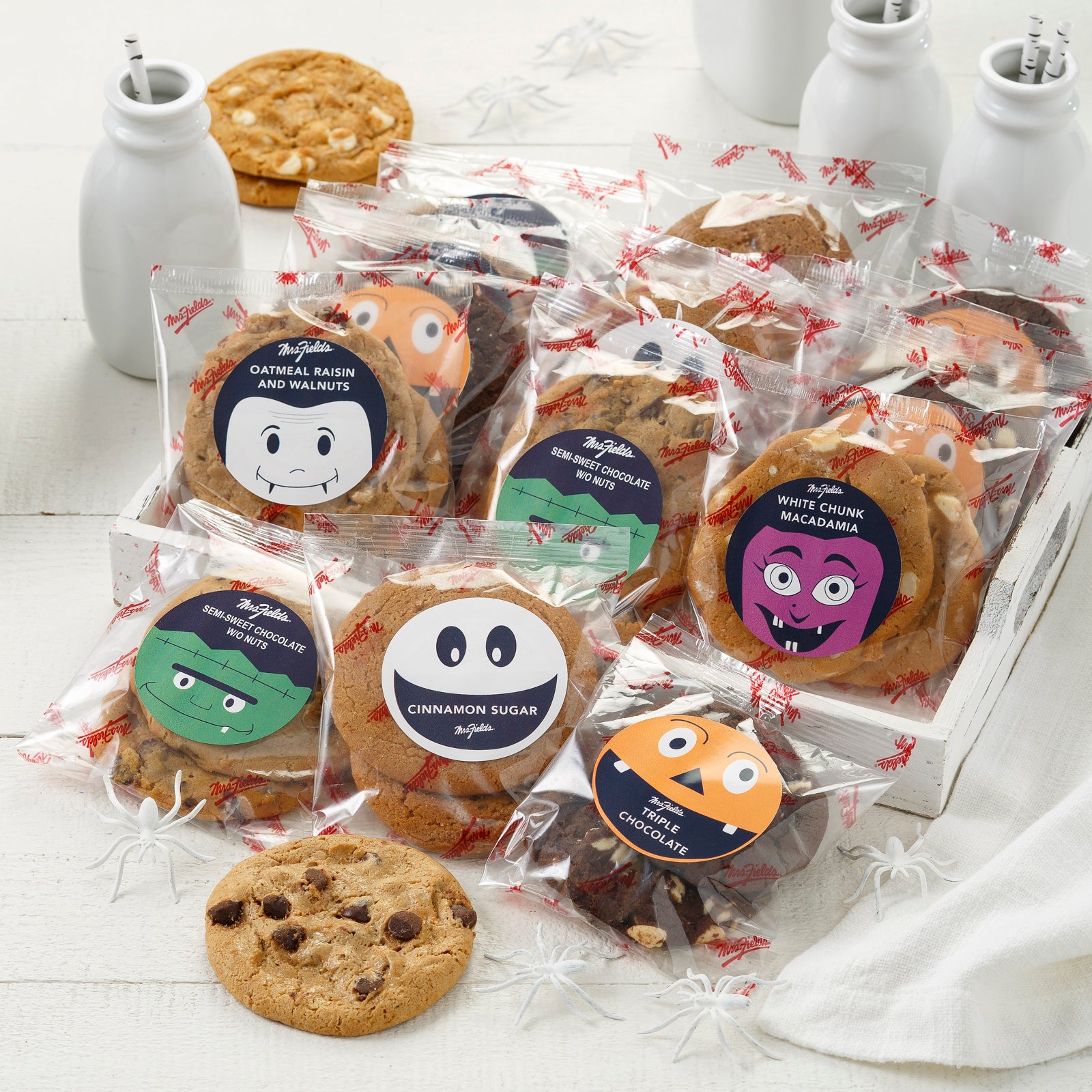 An assortment of packaged original cookies with Halloween themed stickers.