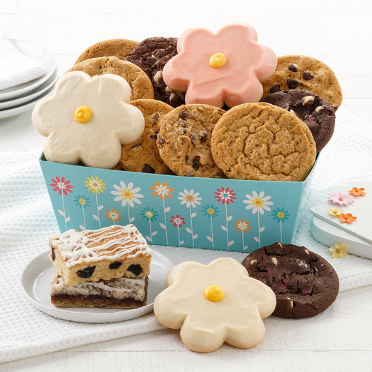 A blue spring themed gift crate filled with an assortment of original cookies, fruit bars, and frosted daisy cookies