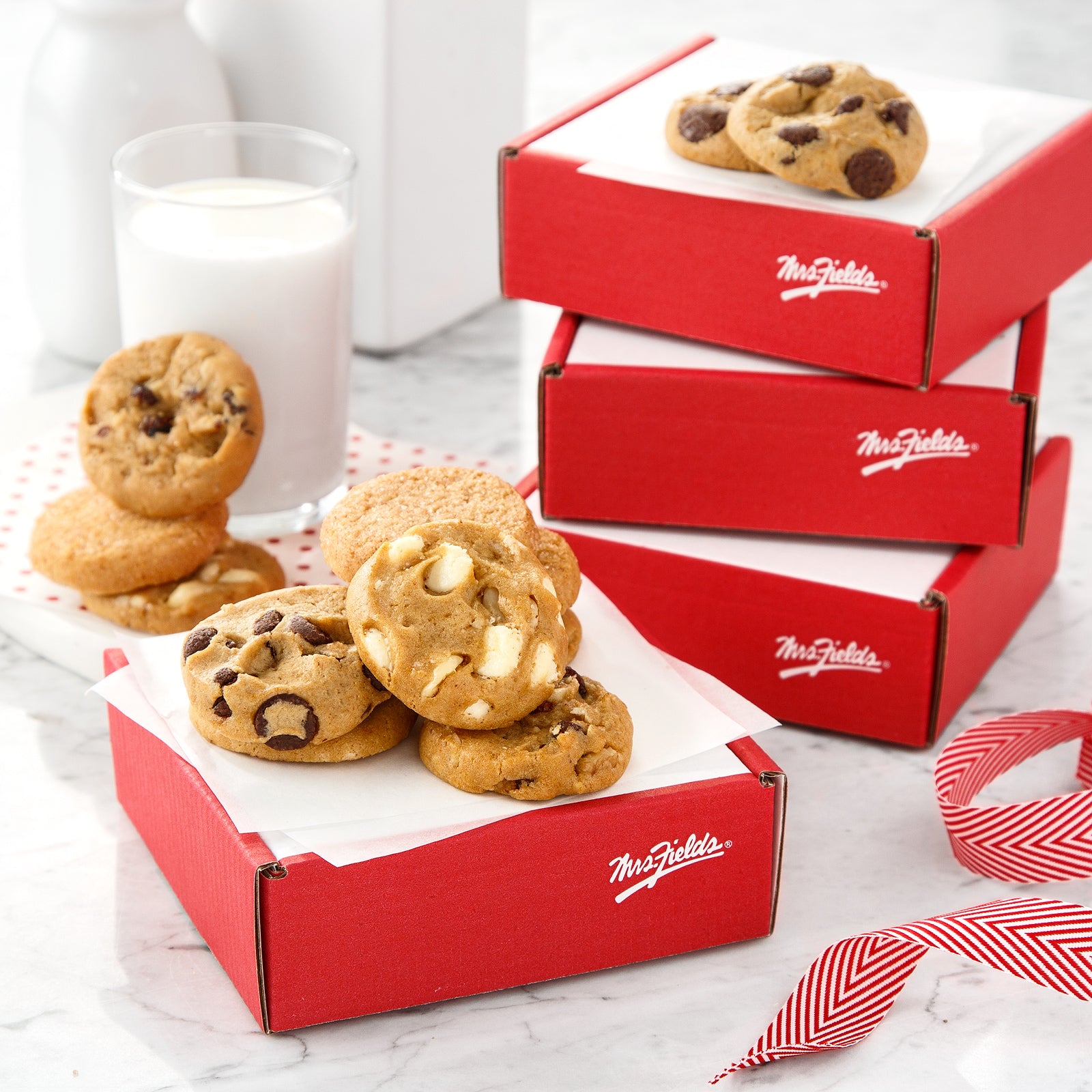 Mrs. Fields red and white corrugate boxes filled with Nibblers® Bite-Sized cookies. Comes in a case of 12