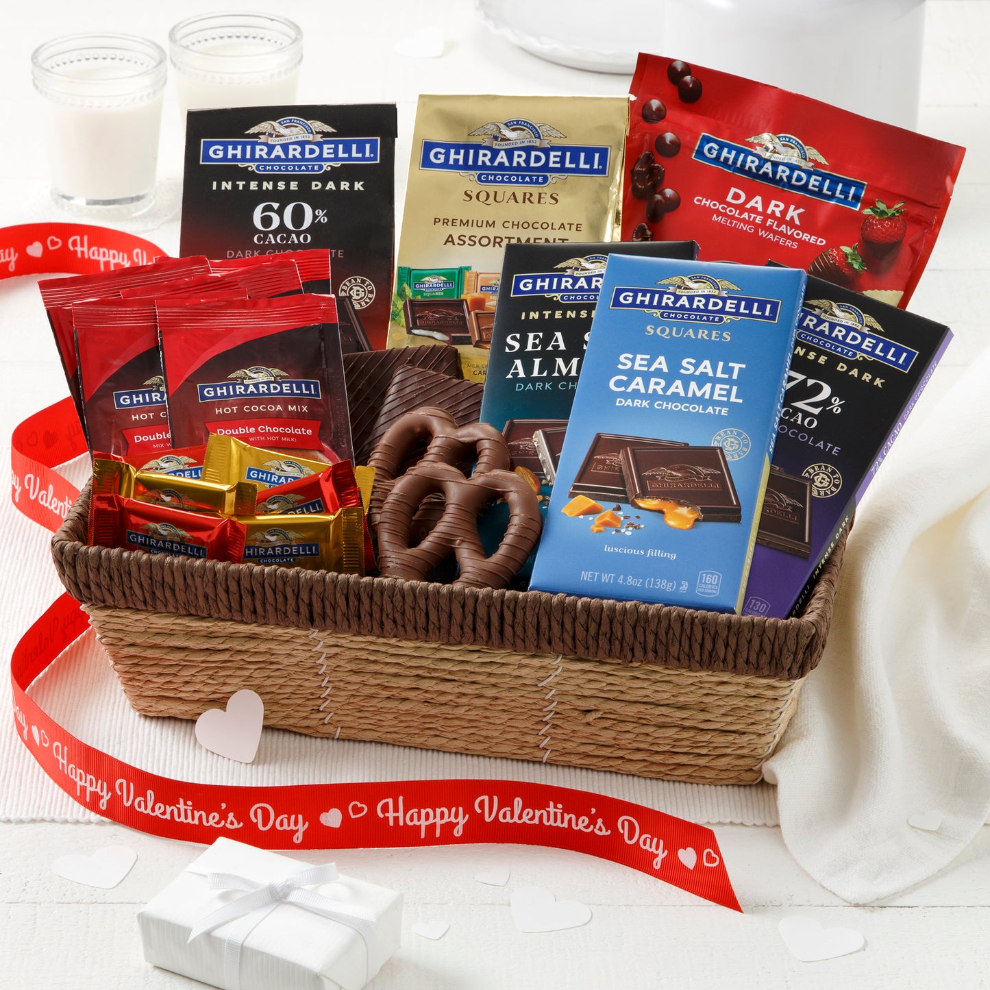 A brown basket filled with an assortment of Ghirardelli chocolates