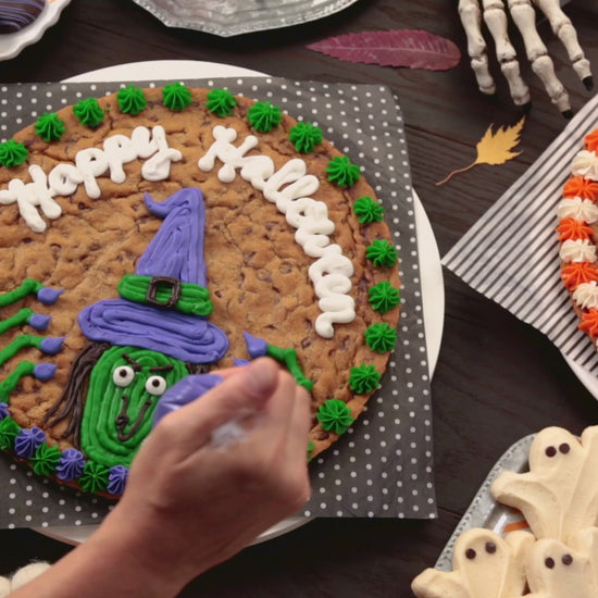 A video that shows decorating the different halloween cookies cakes and halloween frosted cookies
