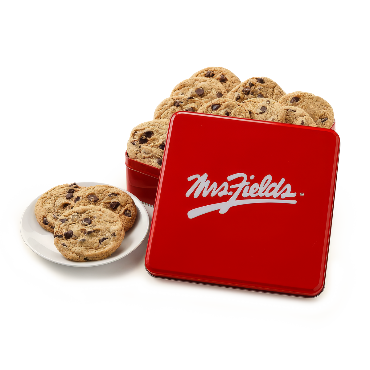 A red square metal cookie tin with the white Mrs. Fields logo on the lid, shown with chocolate chip cookies in a matching round tin behind it and one cookie on a small white plate in front, all on a clean white background.