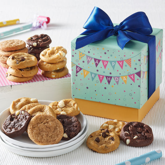 Happy Birthday mini gift box surrounded by an assortment of nibblers