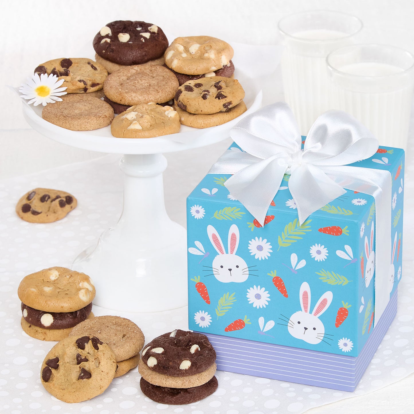 Mini blue Easter themed gift box surrounded by an assortment of nibblers