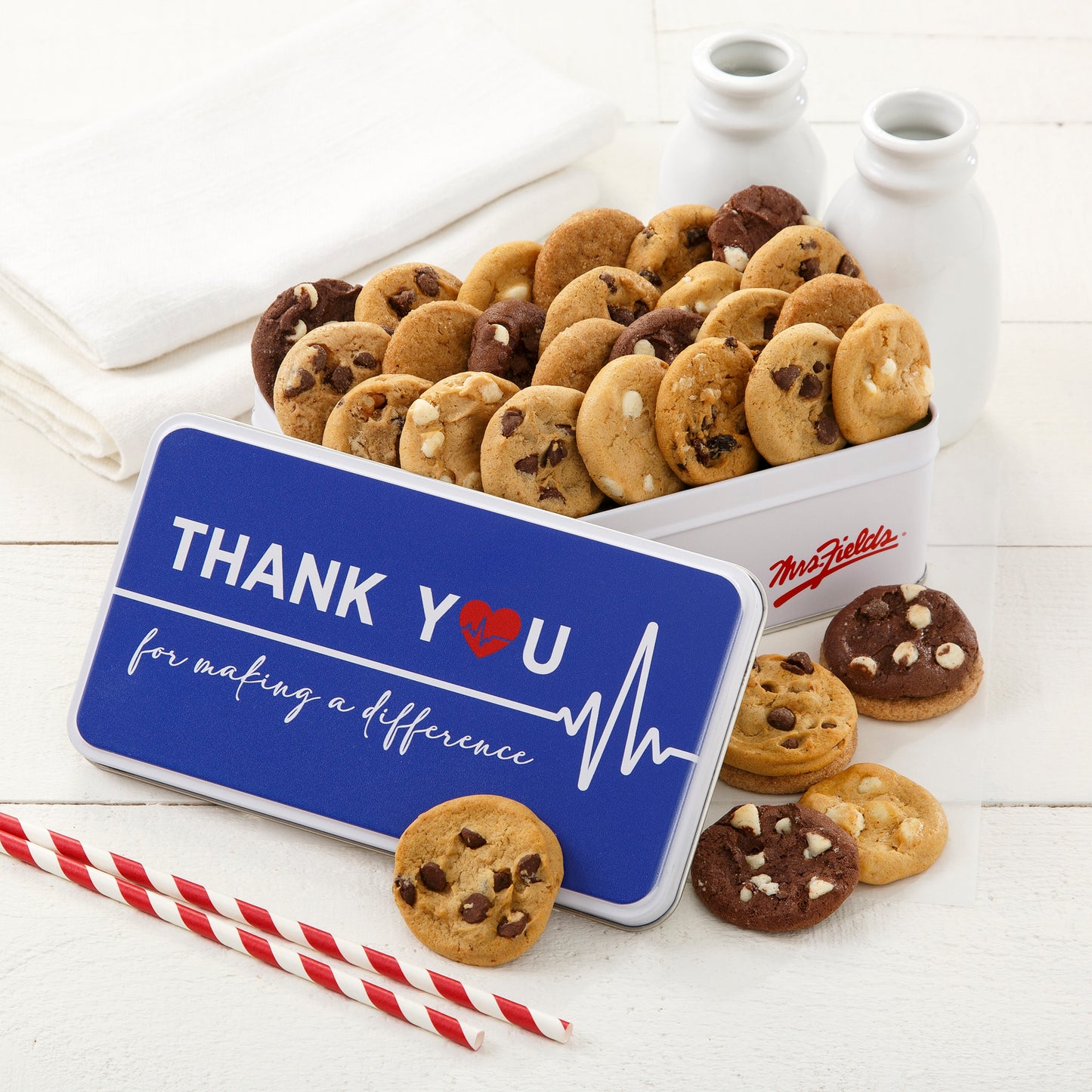 Thank You For Making A Difference gift tin filled with an assortment of nibblers